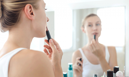 Woman putting make-up